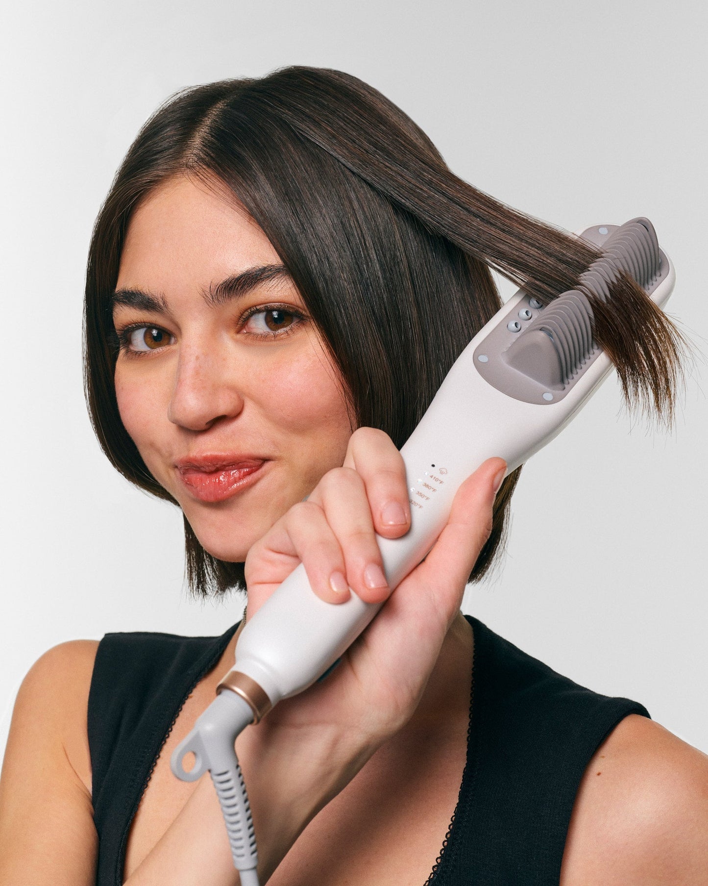 Steam infused permanent straightening brush